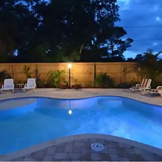Palm Breeze Pool at Night | CSE Properties, Naples, FL