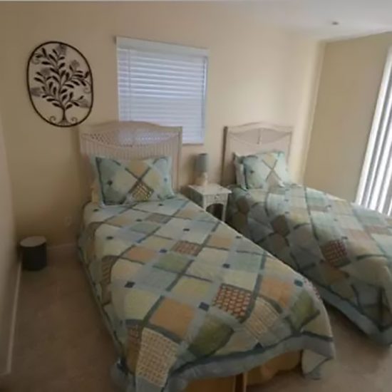 The Pelican Nest Guest Room with Twin Beds | CSE Properties, Naples, FL