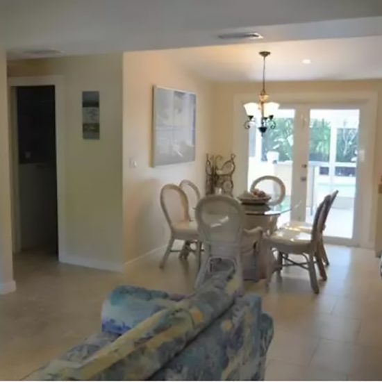 The Pelican Nest Living and Dining Areas | CSE Properties, Naples, FL